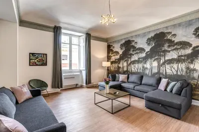 a living room with a couch and a table at The Great Green in Rome