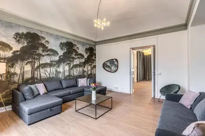 a living room with a couch and a table at The Great Green in Rome