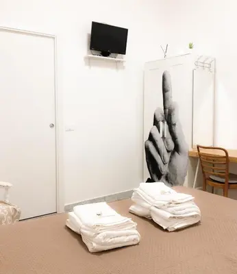 a table with two white towels on top of it at Garbatella House in Rome