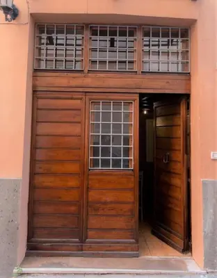 a pair of wooden doors in a building at Monti Wood Loft in Rome