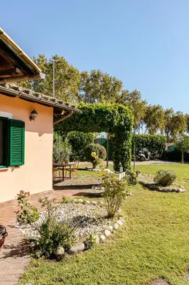 a garden with a pergola next to a house at Peaceful Haven in Rome in Rome