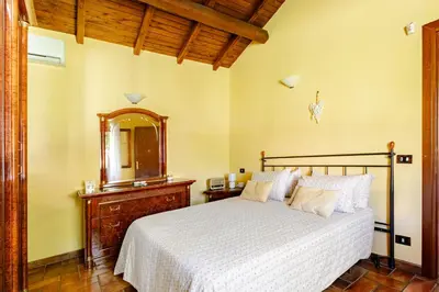 a bedroom with a bed and a mirror at Peaceful Haven in Rome in Rome