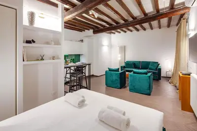 a living room with a couch and a table at Casa Annamaria al Pantheon in Rome