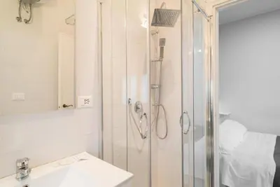 a bathroom with a shower and a sink at Magenta Collection Terrione 25 in Rome