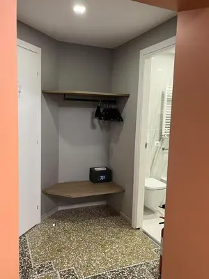 a room with a bathroom with a sink and a toilet at Vatican museum guest house in Rome
