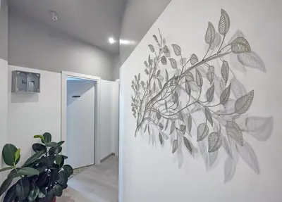 a wall mural of a plant on a wall at Vatican museum guest house in Rome