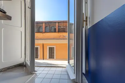 an open door with a view of a building at Demetra - Little Loft a Trastevere in Rome