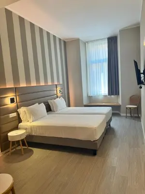 a hotel room with a bed and a window at RESIDENZA 62 in Rome