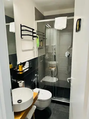 a bathroom with a sink and a toilet and a shower at RESIDENZA 62 in Rome