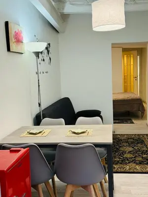 a dining room with a table and some chairs at La Casa di Cinzia in Rome