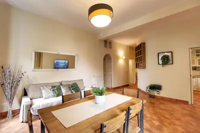 a living room with a couch and a table at Charming Vatican LargeApt by YH in Rome