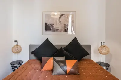 a bedroom with a bed with pillows on it at The best in Rome Monserrato in Rome
