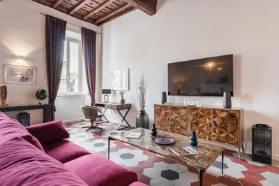 a living room with a couch and a tv at The best in Rome Monserrato in Rome