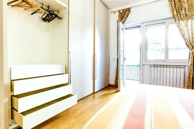 a living room with a dresser and a window at Lovely apartment in Rome - Casetta Mattei in Rome