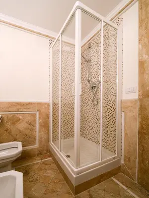 a shower with a glass door in a bathroom at Polinari Rooms San Pietro Roma in Rome