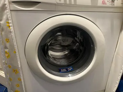 a close up of a washing machine with its door open at La casetta a monti in Rome