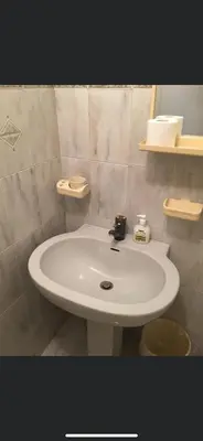 a bathroom with a white sink in a room at La casetta a monti in Rome