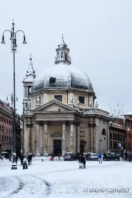 a large building with a dome in the snow at Divine Bed & Breakfast in Rome