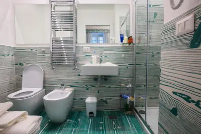 a bathroom with a sink and a toilet at Divine Bed & Breakfast in Rome