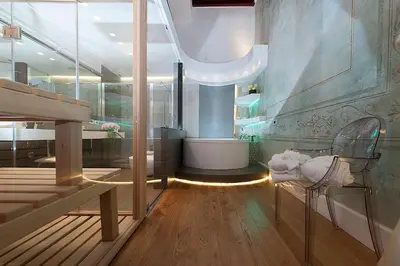 a bathroom with a tub and a toilet and a sink at Argentina Residenza Style Hotel in Rome
