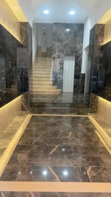 a lobby with a marble floor and stairs at Hotel Sallustio in Rome