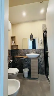 a bathroom with a sink and a toilet at Hotel Sallustio in Rome