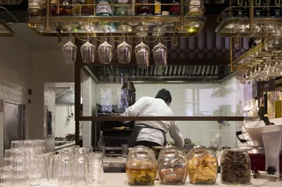 a man in a kitchen preparing food in a kitchen at Passpartout Boutique Palace in Rome
