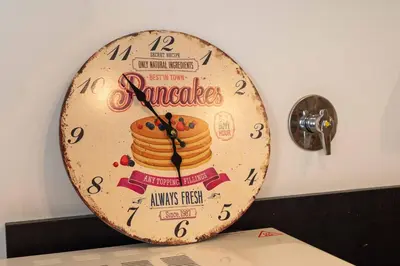 a clock with a pancake sign on a wall at Domus Montebello in Rome