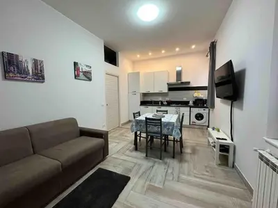 a living room with a couch and a table at Family Flat near Metro A in Rome