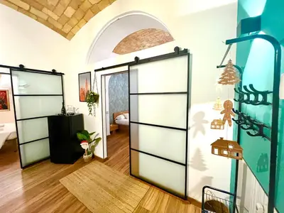 a room with two sliding doors in a room at NEW Look8 Vatican Home in Rome