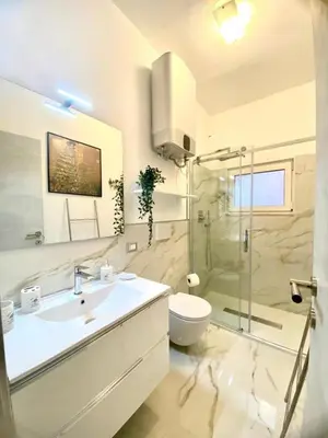 a bathroom with a sink and a toilet and a shower at NAVONA SUITE VIOLA in Rome
