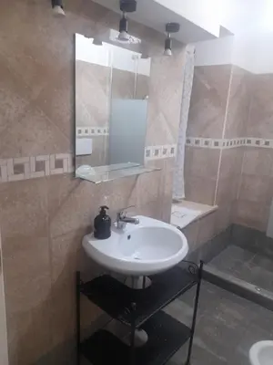 a bathroom with a sink and a mirror at casa di lella ai musei vaticani in Rome