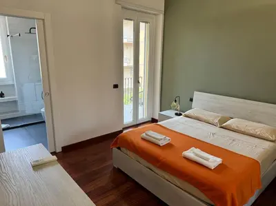 a bedroom with a large bed with two towels on it at Quarto Piano - intero alloggio a Roma in Rome