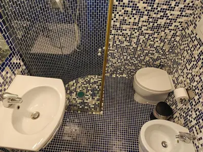 a bathroom with a sink and a toilet at Quarto Piano - intero alloggio a Roma in Rome
