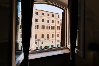 an open window with a view of a building at Pigna suite in Rome