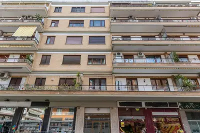 a tall building with windows and a balcony at 2 Vatican St Peter's Daniele apartment Barone in Rome