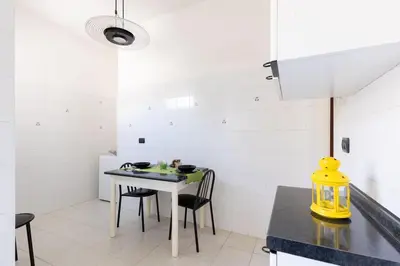 a kitchen with a table and chairs in a room at 2 Vatican St Peter's Daniele apartment Barone in Rome