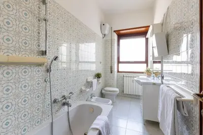 a bathroom with a tub and a toilet and a sink at 2 Vatican St Peter's Daniele apartment Barone in Rome
