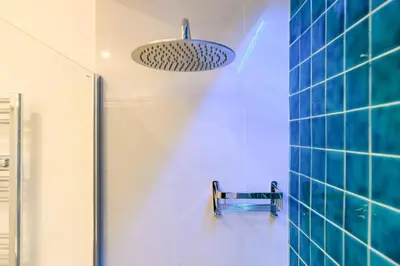 a bathroom with a shower and a light fixture at Modern & Elegant by NDP rent in Rome