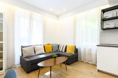a living room with a couch and a table at Modern & Elegant by NDP rent in Rome