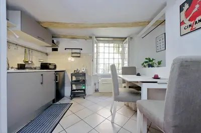 a kitchen with a table and a table and chairs at Al moretto in Rome