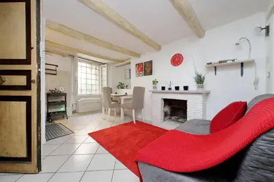a living room with a couch and a fireplace at Al moretto in Rome