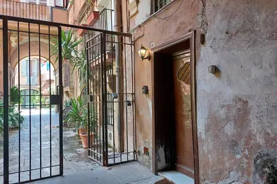 an entrance to a building with an iron gate at Al moretto in Rome