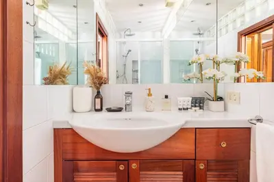 a bathroom with a white sink and a mirror at 4 Townhouse by the Spanish Steps in Rome