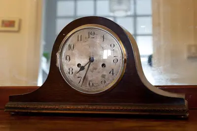 a wooden clock sitting on top of a table at Claudia B&B in Rome