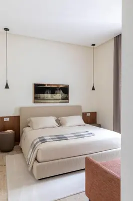 a bedroom with a large bed in a room at Le Case di Andrea - Luxe Rome apartment in Rome