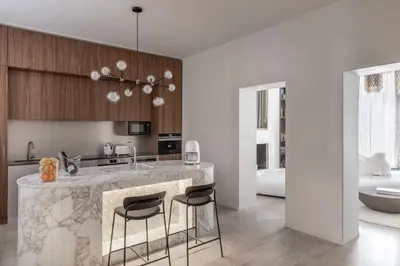 a kitchen with a marble counter top in a room at Le Case di Andrea - Luxe Rome apartment in Rome