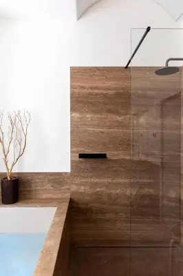 a bathroom with a glass walled shower at Le Case di Andrea - Luxe Rome apartment in Rome
