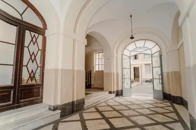 an empty hallway of a building with an open door at Valentine's Dream in Rome
