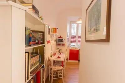 a room with a table and a dining room at La Casa di Vittorio boutique Ottaviano San Pietro in Rome